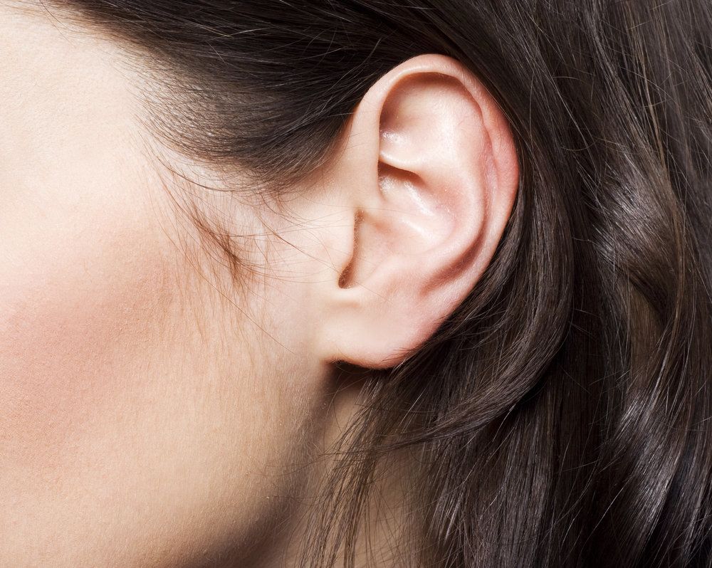 Close up of brunette woman's attractive ear