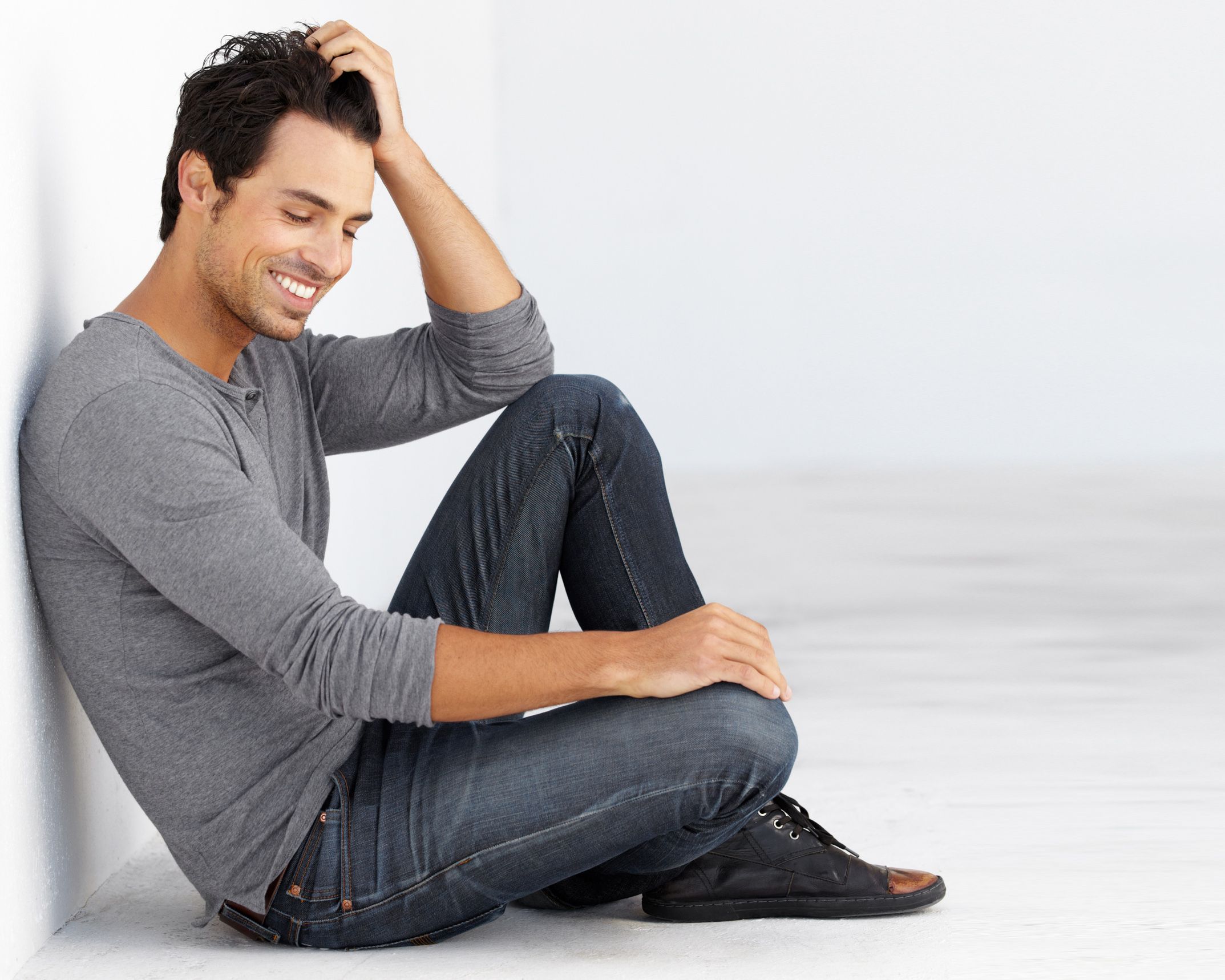 Photo of a man sitting and smiling